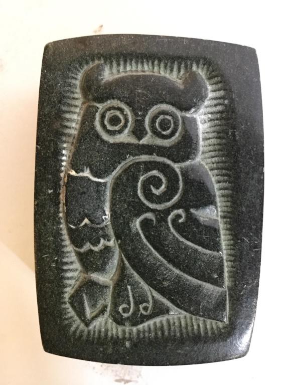 Vintage Carved Stone Trinket Box W Lid: Trinket Box appears to be vintage. Lid has carved image of owl. Lid is black toned, Box is sand sand toned. Lid and box appears to be stone. Piece measures approx 3.5 inches long 2 inches wide, 1.5 in