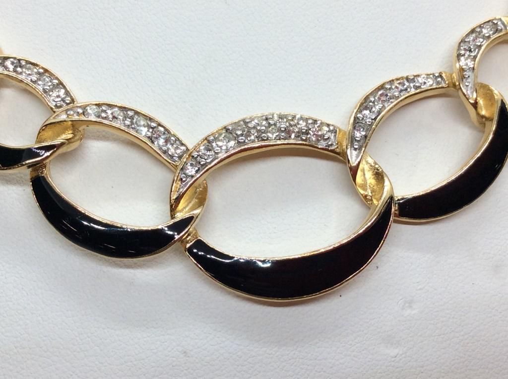 Trifari Rhinestone & Enamel Loop Panel Necklace: Underside of panel marked for Trifari. Black tone enamel and white rhinestones against gold tone chain. Drop length Measures approx 7 inches. Statement jewelry, Estate jewelry, fashion accessory, cost