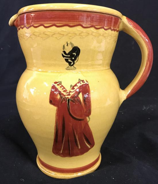 Gold And Red Toned Earthenware Painted Pitcher: Gold And Red Toned Ceramic Painted Pitcher depicting a robed female figure, numeric black marks to lower edge, illegibly stamped on underside, measures approximately 8 inches tall x 7.25 inches wide. 
