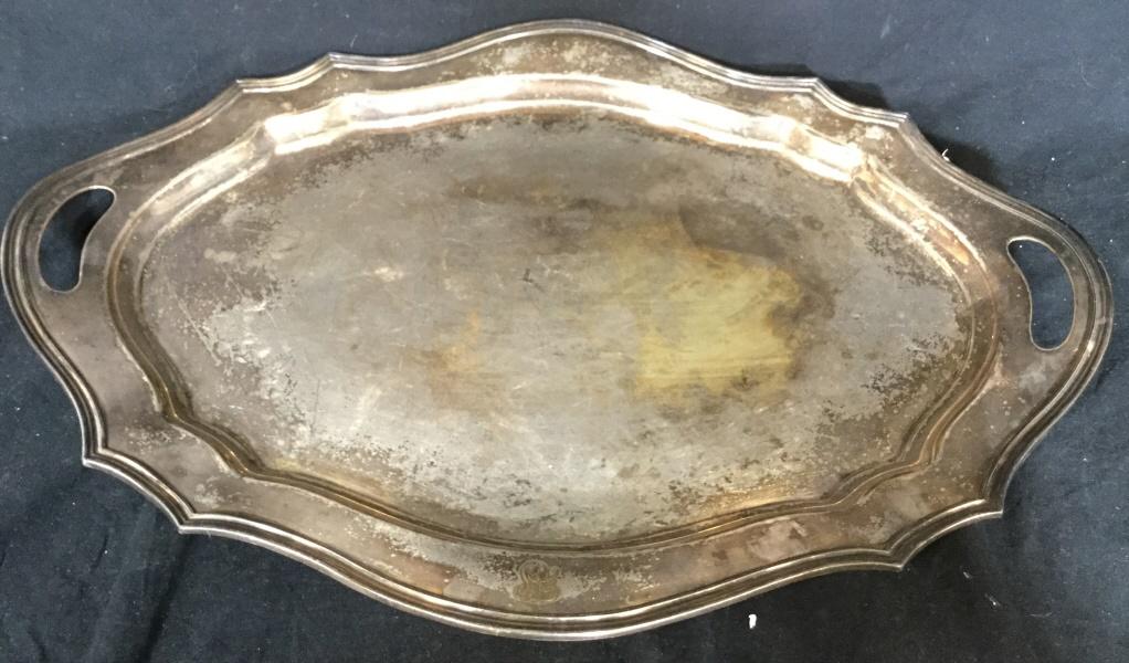 REED & BARTON Silver Toned Metal Serving Platter: Underside of piece is marked REED & BARTON EPNS. Piece has handles. Tray is silver toned & Metal. Piece measures approx 24 inches long 18 inches deep. Contains wear. serving tray, tableware, decorativ