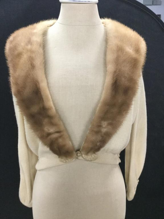 Vintage Mink Collar Cropped Cashmere Sweater: Medium Blond Fur On Collar and lapel. Can be removed, snaps on. Sweater fabric, cashmere. Cuffs adorned with double buttons. Taper at wrists. Interior lined, but not in arms. Hook and loop closure at