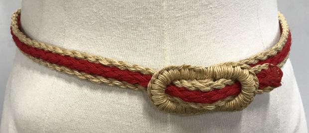 Braided Rope Belt: Braided heavy yard in red and camel color. Belt buckle also braided. Simple loop fastening. 35 in. long, Waist size, 32 in. approx. Buckle 3 1/4 x 1.5 in. Belt width 3/4 in. Wearable Accessory, Belt, 