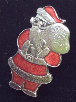 ‘Santa’ Red And Silver Tone Enamel Pin: Mr. Clause carrying a sack of toys. Red enamel on silver toned finish. 1. 1/4 in long. Christmas Pin, Santa Pin, Holiday Pin, Xmas Jewelry, Fun Fashion, Children’s Accessory, Ladies Accessory, Fashi