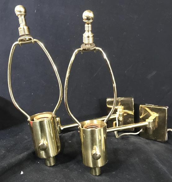 Pair Gold Toned Hinson Retractable Wall Lamps: Pair of gold toned wall lamps. Fully extended measures approximately 18 inches. Approximately 11.5 inches in height. Back of wall plate reads hhd Hinson lamps New York metal arts made in Spain manufac
