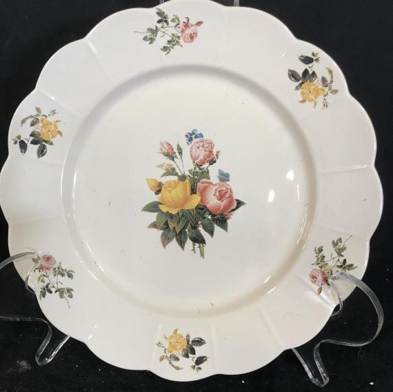 Vintage ceramic flower printed plate: Vintage ceramic plate with flowers printed on. Measures approximately 10 inches diameter. Brand unknown. Print is worn from plate. Plate, ceramic, ceramic plate, vintage, tableware, serveware, tableto