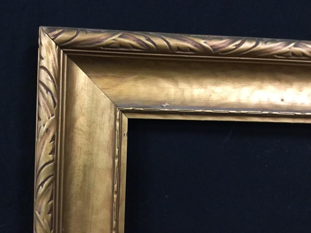 Gold Toned Carved Wooden Frame: Frame is gold toned and wooden. Piece measures approx 37 inches long 30 inches tall. Frame appears to possibly be vintage. frame, decorative arts and accessories, home decor, art frame, mirror frame. 