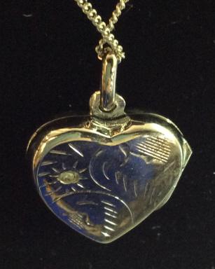 825 Silver & Pave Diamond Heart Locket: Locket Marked 825 on interior top of heart indicating silver purity. Possibly 18 K white gold overlay. Chain marked 925 on spring ring clasp. Comes in box marked 18K Gold Finish From AVIVA. Front etch