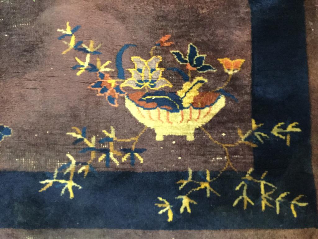 Vintage Handmade Chinese Art Deco Rug: Rug is vintage and handmade possibly antique. Piece contains floral vine and leaf detail. Piece contains tones of purple, navy, beige, and cream. Piece measures approx 69 inches long 36 inches wide. H