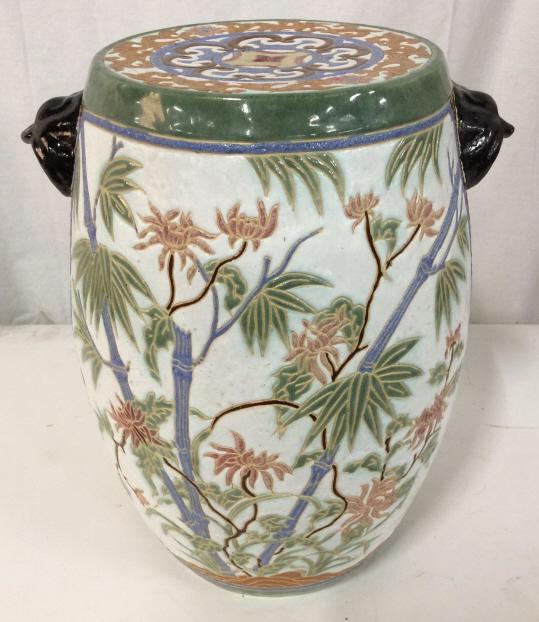 Asian Porcelain Ceramic Garden Stool: Asian Porcelain Ceramic Garden Stool With intricate multicolored glazed design, bamboo and floral design in one panel and cherry blossom design on reverse panel, top and sides have floral and scroll m