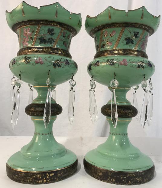 Pair Gilt & Green Glass Opaline Lustres: Pair of green glass opaline lustres with gilt and floral decoration and button and spear crystals. Each measures approx 13.2 inches in height by 6.5 inches in diameter. Some surface wear like fading o