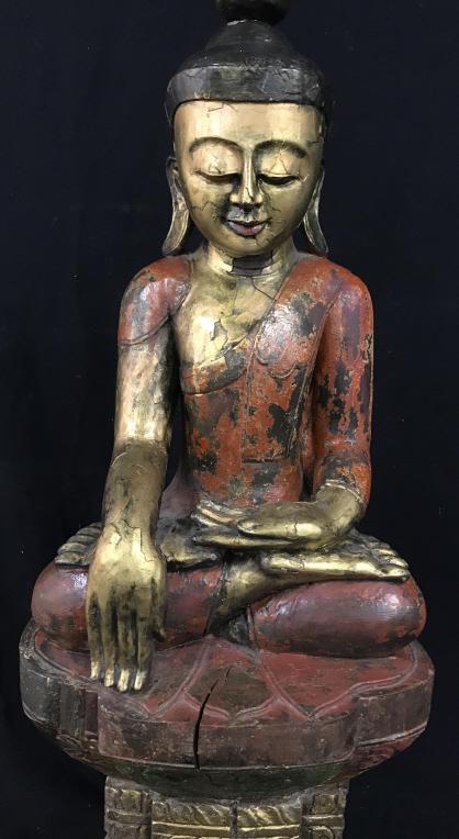 Floor-Size Signed Carved Wood Seated Buddha Statue: Signed with Asian lettering along bottom. Seated Buddha appears to be carved from single block of wood. Sculpture is painted gold tone with red orange clothing and black hair. Guardian lion Figurines 