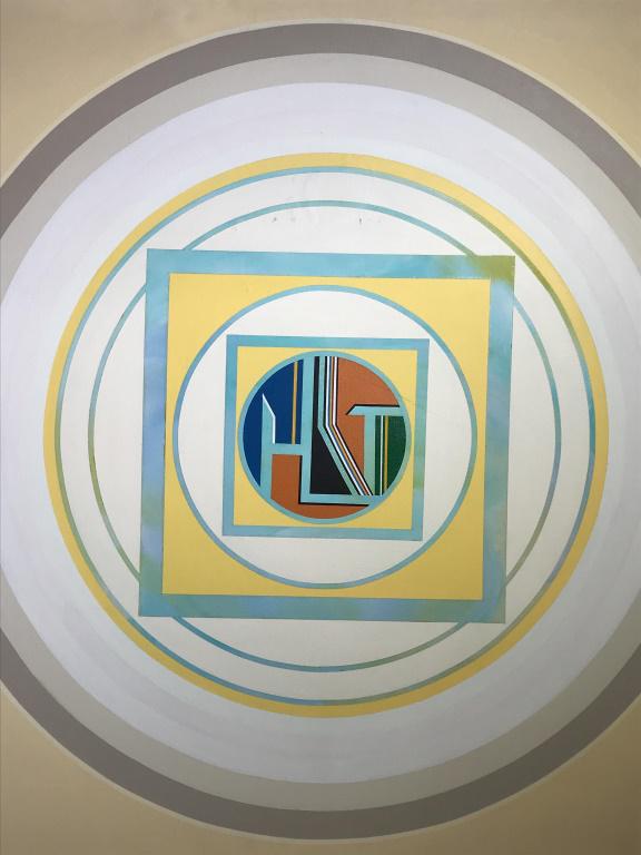 Verso Signed BEKER Acrylic on Canvas, Mandala: Verso signed BEKER, attributed to Gisela Becker (Swiss b. 1932). Acrylic painting on canvas depicts mandala style motif. Titled ‘Yellow Mandala’ on verso. Canvas is set in wood frame with metal st