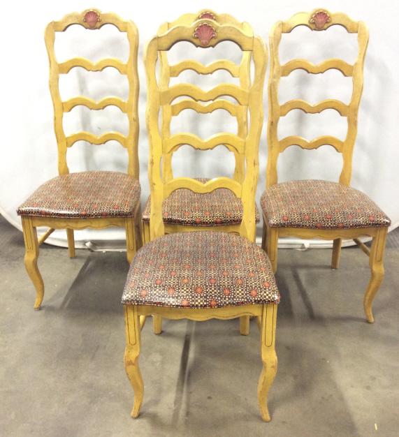 Set 4 Carved Vintage Wooden Side Chairs: Chairs have carved wooden detail. Tops of chairs have carved shell like shaped Detail. Chairs have ladder back rests with irregularly shaped rungs. Cushions are Upholstered with red, beige, and chocol