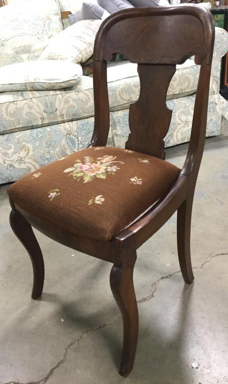 Vintage Wooden side chair W Needlepoint Seat: Lot includes a vintage carved wooden chairs. Piece has Floral Detailed Needlepoint Upholstered seats. side chairs, dining chair, Needlepoint seat chair, floral Detailed chair. Chair has some cracks. S