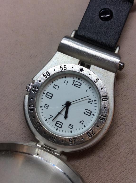 Sheridan Non Tarnish Keychain Hook Watch: Push button and watch opens. Has large hook to attach a key ring or attach to jeans. Fits in pocket. Hardware material is stainless steel. Metal Etched with ‘Westchester Country Club, Rye NY’. 5 i
