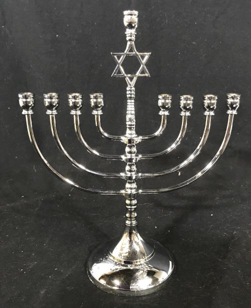 Silver Toned Menorah with Star of David: Thin tapered candles fit into the holders, approx 3/8 in. no major scratches or wear. Center Top is Star of David. 11.5 in. Tall, 9 in. Wide. Base, 4 1/4 in. diameter. Israeli Ware, Menorah, Silver To