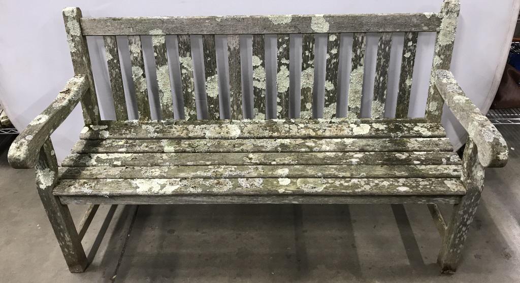 Wood Classics U.S.A. Outdoor Teak Bench: Marked on side for Wood Classics, U.S.A. Outdoor teak bench measures approx 36 inches in height by 60 inches in width by 20 inches in depth. Discoloration and weathered surface wear consistent with ou