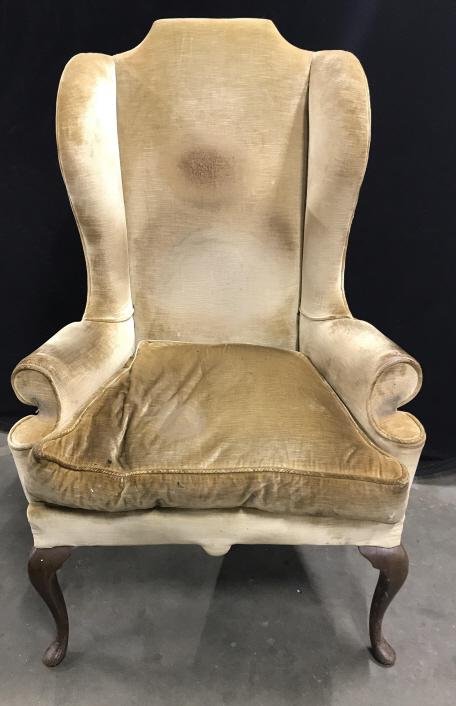 Vintage Upholstered Wingback Chair: Vintage possibly antique Upholstered Wingback Chair In Caramel Toned Velvet upholstery and cabriole front legs, chair fabric shows heavy signs of wear and discoloration, wood legs have scratches and c