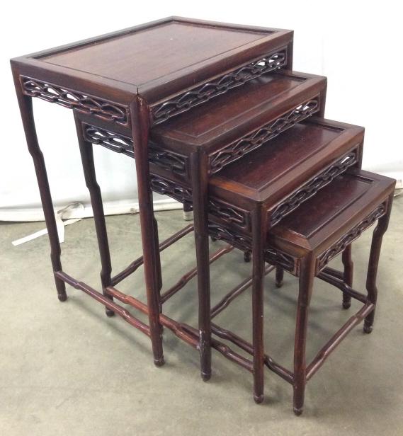 Vintage Carved Wooden Nesting Tables: Nesting tables appears to possibly be Mahogany. Each piece has carved wooden detail. Largest table measures approx 24 inches tall 19 inches wide 14 inches deep. Each have some scratches and wear. 1 ta