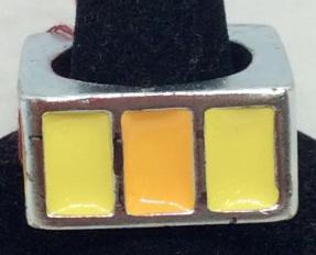 Tommy Hilfiger Square Enamel Fashion Ring: Enameled yellow & orange on 3 sides with washed silver tone metal. Labeled Tommy Hilfiger by Designer. Ring has some metal discoloration. Enamel vibrant. Size 7. 3/4 x 3/4 in. Designer Ring, Fashion A