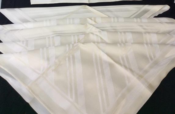Vintage Table Linens Ensemble, Set 7: Silver threat on cream background. 61 x 80 in. tablecloth with contemporary diagonal line design. Light blemishes. Feels like a cotton -rayon blend. No tears, holes, thread pulls. Matching Dinner Napk