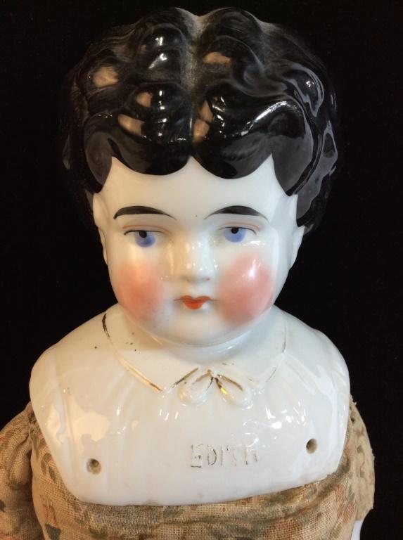 Antique collectible Hand Painted Porcelain Doll: Â‘EdithÂ’. Lightly raised writing on porcelain chest, Gilt faded. Painted porcelain head, arms and lower legs. Body is vintage cloth, one patch on reverse, one sm tear in cloth lower leg. No chi