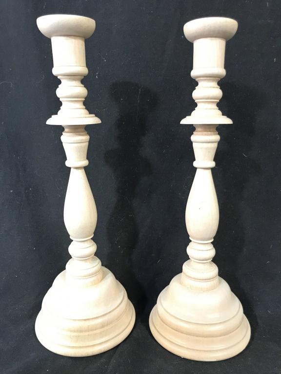 Pair Carved Wooden Sand Toned Candlesticks: Candlesticks are wooden. Pieces are sand toned. Candlesticks, wooden candlesticks, home accent, tabletop decor, decorative arts and accessories, pair of candlesticks. Each measures approx 13 inches ta