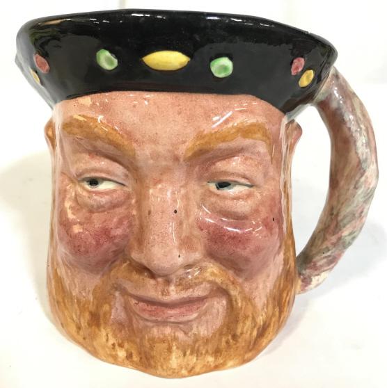 LANCASTER & SANDLAND BLUFF KING HAL Mug: Underside of piece reads LANCASTER & SANDLAND BLUFF KING HAL HANDPAINTED MADE IN ENGLAND. Piece depicts a bearded male figure wearing a hat. Piece measures approx 5 inches tall 6.5 inches wide with ha