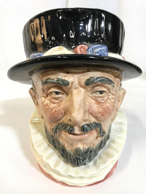 ROYAL DOULTON BEEF EATER Porcelain Mug: Underside reads ROYAL DOULTON BEEF EATER MADE IN ENGLAND. Piece depicts a male figure with mustache and beard wearing a hat. Piece measures approx 6.5 inches tall 6 inches wide with handle. toby mug, 