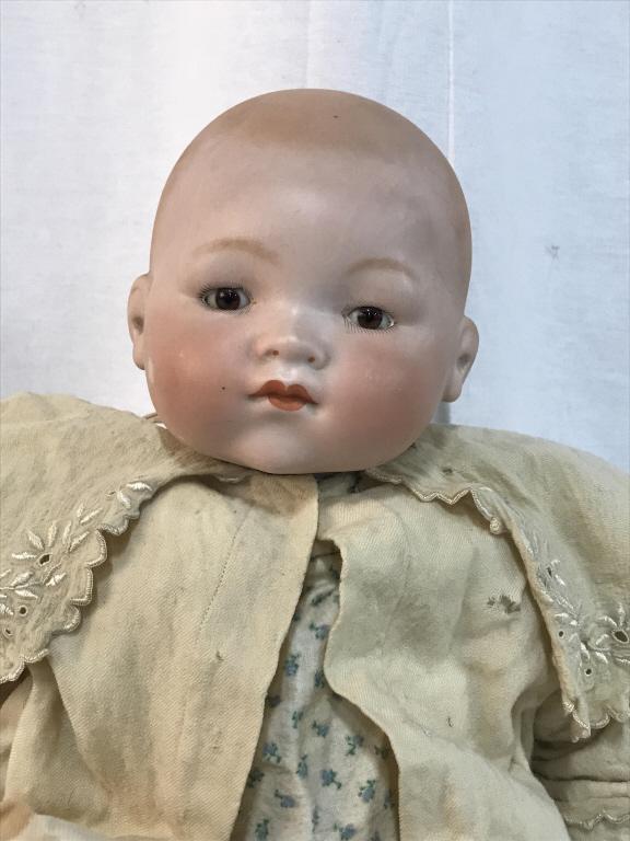 Vintage Child’s Doll: Life like eyes and other facial features, long cape and floral cotton flannel pajama gown. Stuffed body. Ceramic / composite hands, bandaged. Doll measurement 22 x 14 in. Vintage Doll, Child’s Doll,