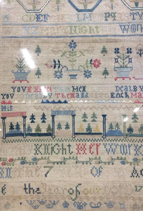 Antique alphabet sampler w Floral motifs c.1739: Antique needlepoint alphabet sampler with floral motifs and decorations. Signed Mary Knight and dated 1739. Wooden frame. Artwork has not been inspected outside of frame. Measures approximately 13 by 