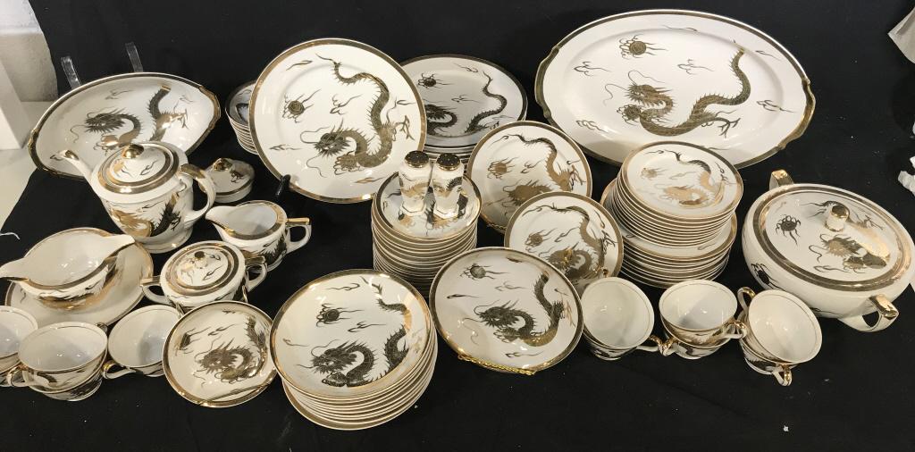 Gilt KUTAMI Porcelain Dragon Dinnerware: Collection of serving bowl, lidded serving bowl/ vegetable bowl, sugar bowl with lid, gravy bowl attached to plate, creamer, 10 shallow dessert bowls, salt & pepper shaker ( missing stoppers underneat