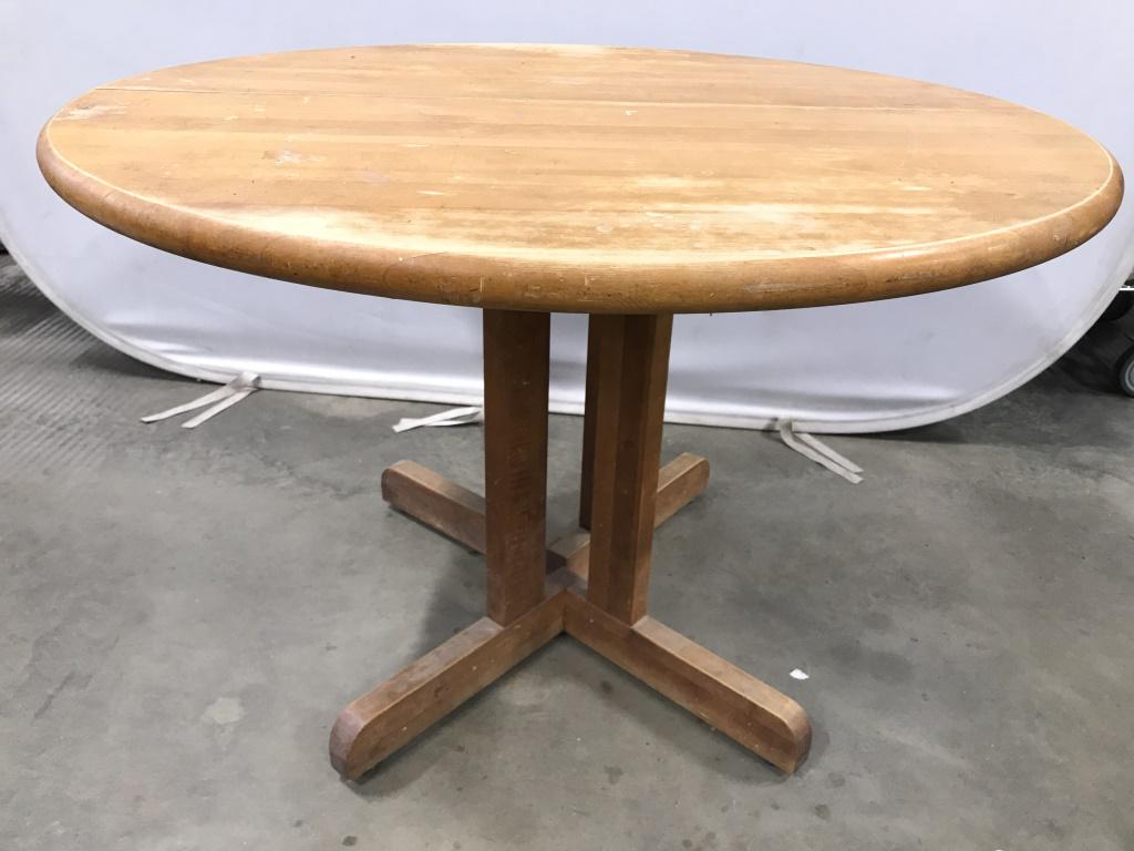 Vintage Round Wooden Dining Table W Leafs: Dining table is wooden. Piece is round. Piece includes 2 leafs which add 12 inches each. Piece without leafs measures approx 42 inches wide 28 inches tall. Contains evident wear and scratches. dining
