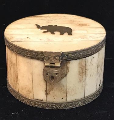 Natural Bone & Brass Trinket Box w Elephant Accent: Vintage Round Trinket Box . Flat Brass Elephant Ornament on top of natural bone. Detailed Floral Brass Rims on lid and bottom of box. Brass toned metal Victorian Style latch, brass toned hinges & nail