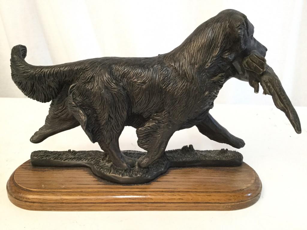 Composite Dog & Pheasant Figural On Wood Base: Piece depicts a walking dog carrying a Pheasant. Base of piece is wooden. Piece measures approx 12 inches long 8.5 inches tall, 6 inches wide. Piece has some chips. vintage Dog Sculpture, Dog accessor