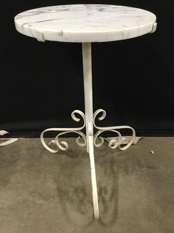 Round Marble Top Metal Base Side: Side table has round top which appears to Possibly be Marble Possibly Stone. Piece has white toned metal base with c and s curve detail. Piece measures approx 22 inches tall 26 inches wide. side table