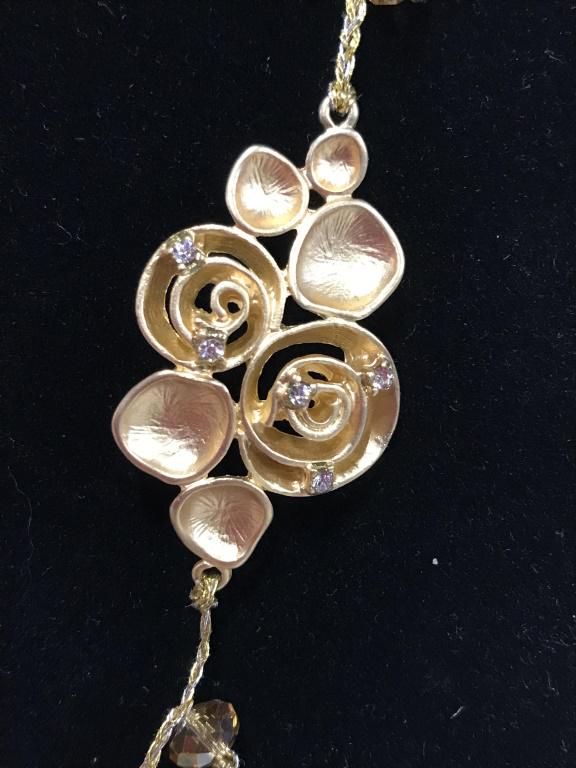 Delicate Amazonite & AB Bead Gold Tone Necklace: With just a touch on light beading on entire necklace. Petite rhinestone decor on organic shaped swirls. Blue beads possibly Amazonite or blue agate. Lobster clasp, adjustable chain, 21-23 in. Fashion