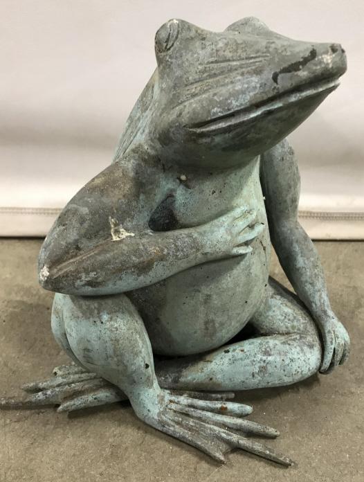 Patinated Metal Pensive Frog Garden Statue: Metal garden statue of a pensive frog, patina green in tone. Measures approx 8 inches in height by 9 inches in width by 5.5 inches in depth. Surface wear like discoloration consistent with age and exp