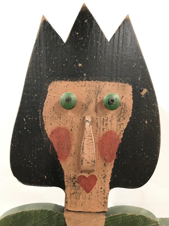 Vintage Folk Art Life Sized Hand Crafted Whirligig: Whirligig has handcrafted & hand painted elements. Piece depicts a female Figural wearing a green dress. Piece reads tulip on base. Piece contains yellow toned planter box. Arms of whirligig move free