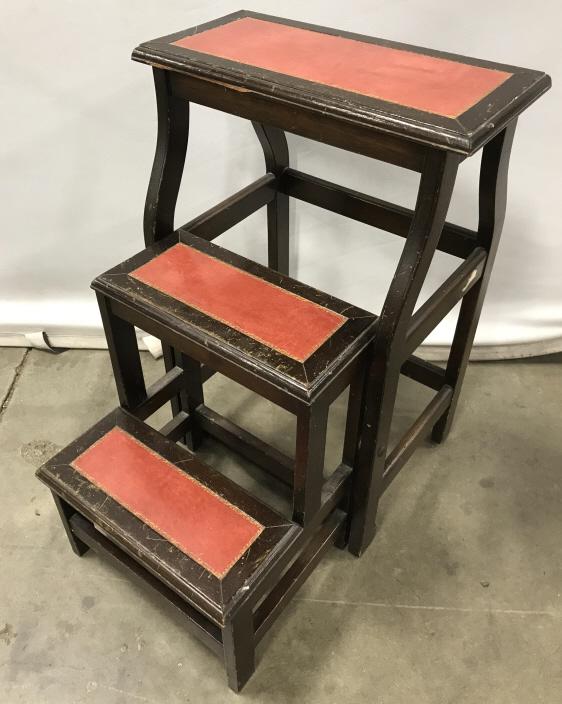 Antique English Gilt Leather-Top Library Steps: Antique English wooden library step stool with gilt tooled leather tops. Stool can be folded inward for storage. Measures approx 23.35 inches in height by 15.25 inches in width by 20.5 inches in depth