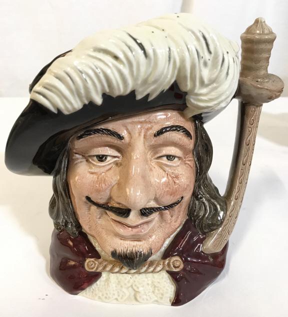 DOULTON & CO LTD PORTHOS Porcelain Mug: Underside of piece reads DOULTON & CO LTD PORTHOS. Piece depicts a male pirate figure. Piece measures approx. 7.5 inches tall 8 inches wide with handle. Appears to be hand painted. toby mug, collectib