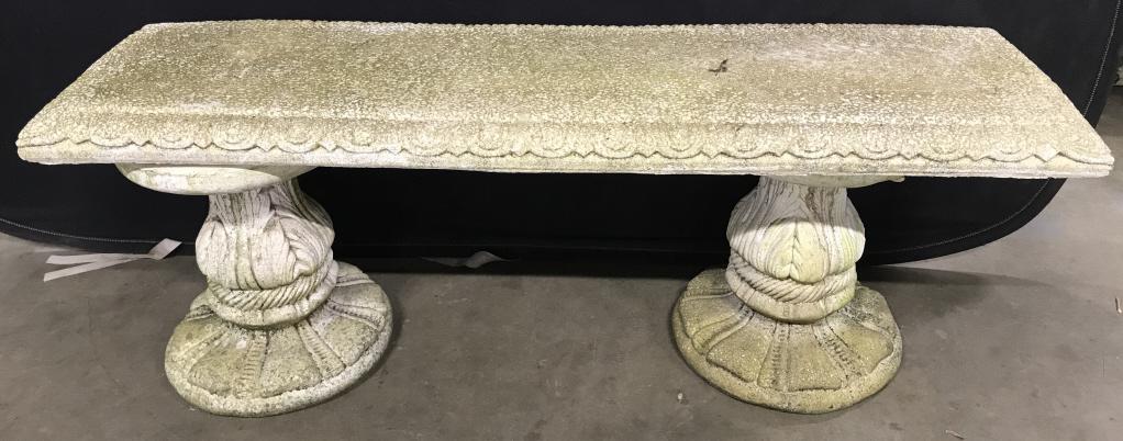 Outdoor Cement Garden Bench: Garden Bench is Cement. Piece includes 2 Cement supports. Contains some carved detail. Measures approx 51 inches long 18 inches tall 15 inches deep. Piece has evident wear and weathering. bench, outdo