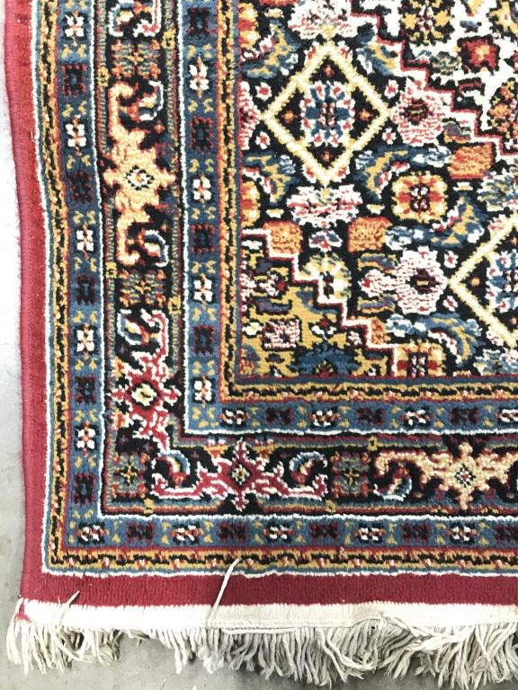 Handmade Floral Detailed Wool Rug: Rug is wool & handmade. Piece contains multi toned floral detail. Edges have fringes. Measures approx 68 inches long 42 inches wide. home furnishings and accessories, textile arts and decor, home deco