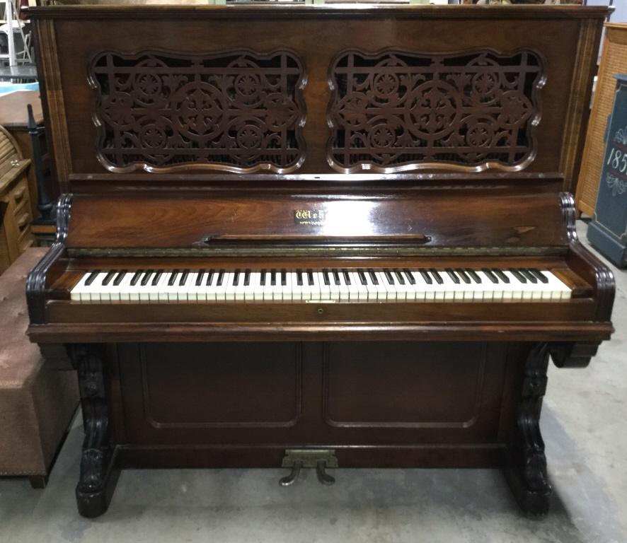 Antique Upright Hand Carved Weber Piano C 1800’s: Measures approximately 60 inches long, 56 inches tall, 28 inches deep. Piece is hand carved with intricate detail. Piece is labeled WEBER NEW YORK. Piece has 2 foot pedals. Contains evident wear due t