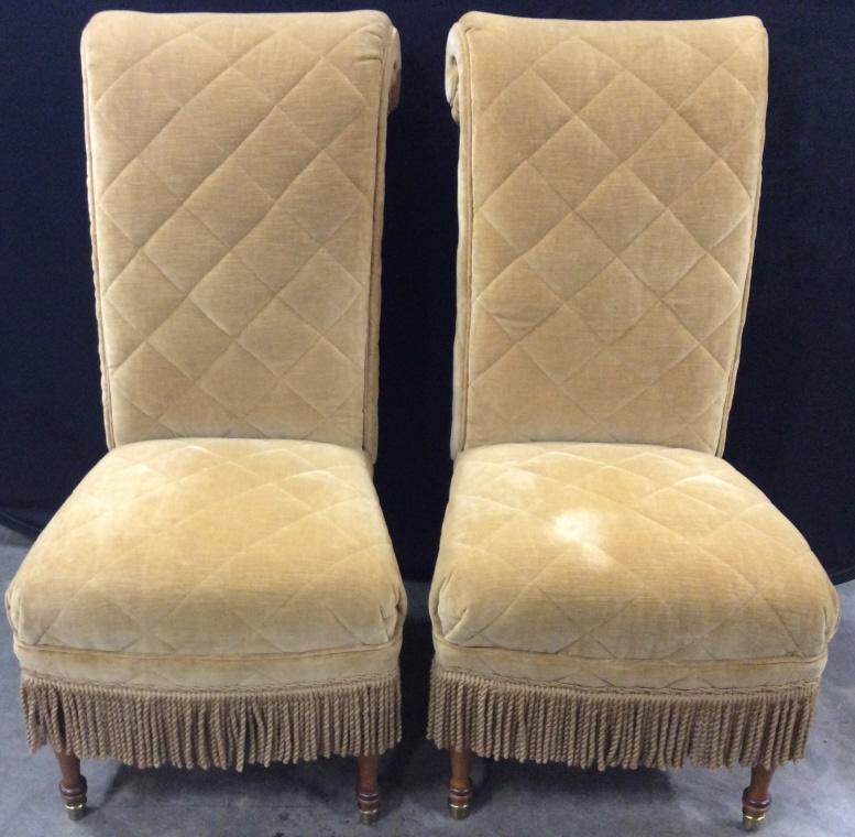 Pair LILLIAN AUGUST scroll back Upholstered Chairs: Underside of each chair has tag which reads LILLIAN AUGUST. Gold toned Clarence House. Quilted velvet upholstery. Coordinating braided trim and fringe. Tall C Scroll. backs. Carved short feet. Brass d