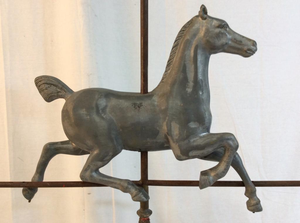 Racing Horse Weather Vane Lighting Rod: Hackney Horse Weather vane circa 1890-1920, iron Mixed Metals of silver tones and brass tones, pink tone glass detail on lower portion, glass has been repaired, measures app 38 in by 26 in by 9 in Arc