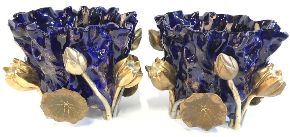 Pair MINTON MOORE Decorative Porcelain Planters: Underside of each planter is marked MOORE. Each piece is blue and gold toned. Each piece measures approx 6.5 inches tall 8 inches wide. Outer area has gold toned floral detail. Pieces have some minor 