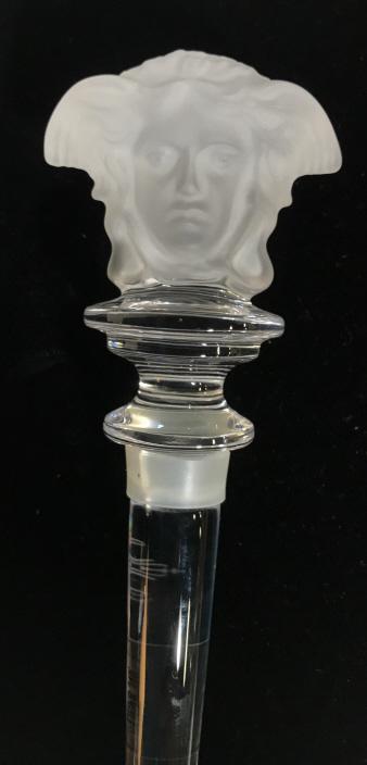 VERSACE ROSENTHAL Crystal Stopper: Rosenthal for Versace BOXED stopper 24% lead crystal from Austria. Frosted glass head Figural. Marked 24% Austrian Crystal on sticker label and stamped ‘Rosenthal Versace’. 5 1/4 in. long. Medusa