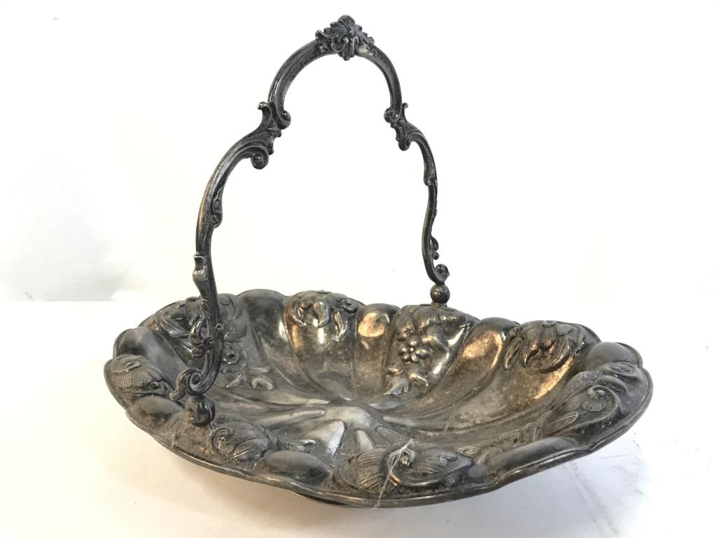 PB & P CO Silver toned metal Centerpiece dish: Basket is silver toned and metal. Piece has Beveled fruit and leaf detail. Piece contains handle. Measures approx 13 inhces long 10 inches tall 9 inches deep. Marked on underside PB & CO 800, 800 poss
