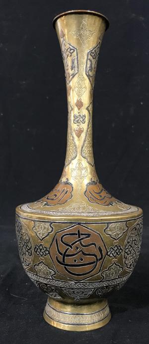 Vintage Brass Hand Etched Syrian Vessel: Vintage Brass Hand Etched Syrian Vessel Vase with copper accents, intricate design and writing symbols, measures approximately 11.25 inches tall x 4.75 inches in diameter, no condition issues noted. M